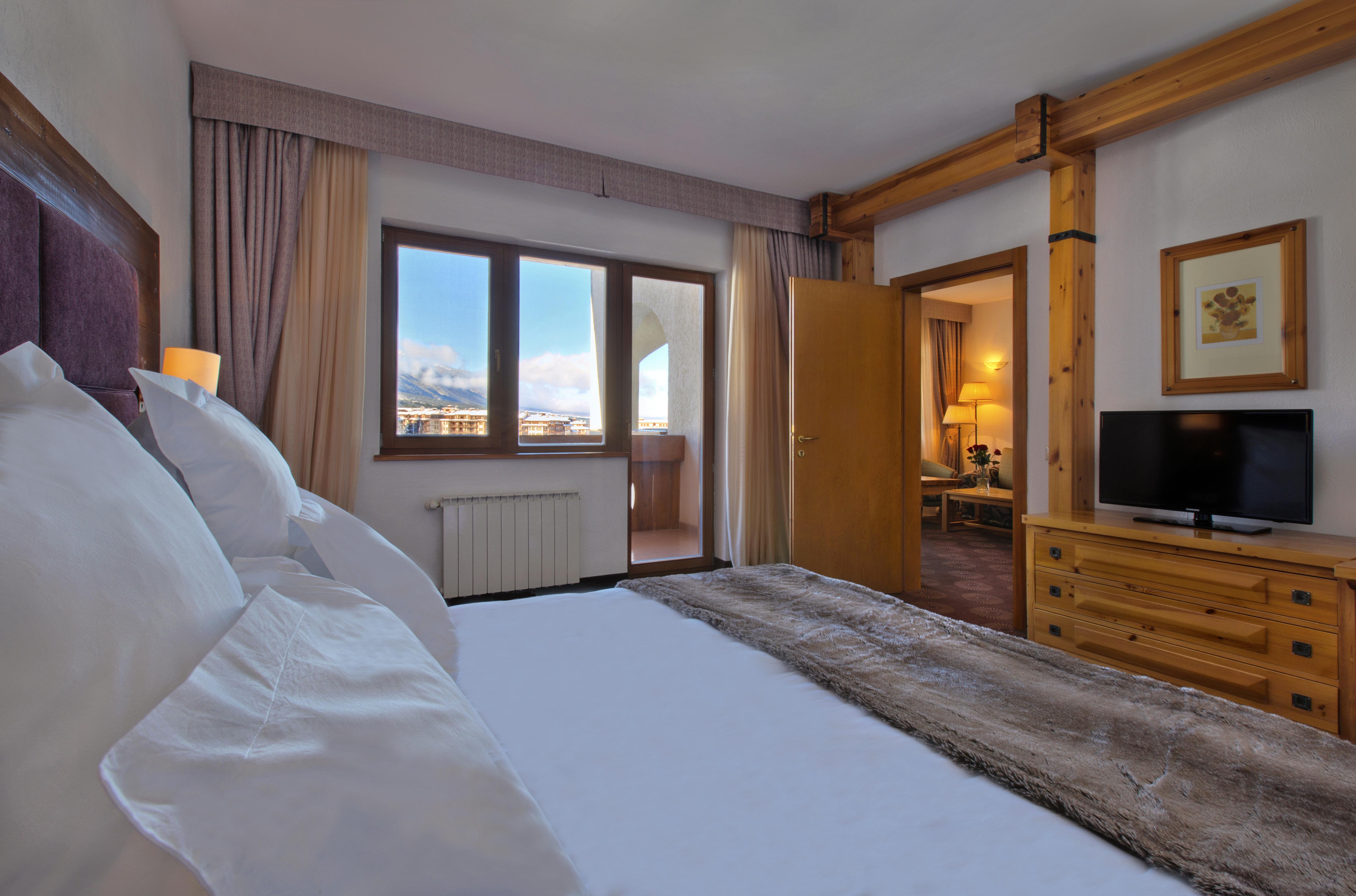 Kempinski Hotel Grand Arena Banszko Kültér fotó A bedroom at the Hotel